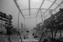 The eerily quiet remnants of the upper deck of an unident... by Byron Dilkes 